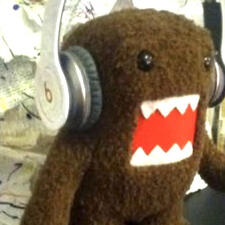 photo of domo-kun with headphones on